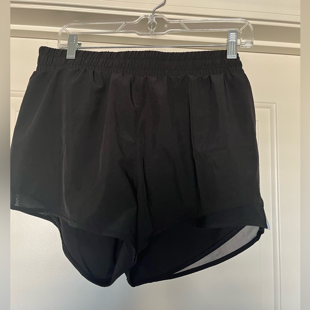 ASICS black and white running shorts with mesh and back pocket. Size Large.